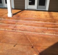 Front stairway patio area of a residential home got its concrete re-stained and resealed in Littleton, CO.
