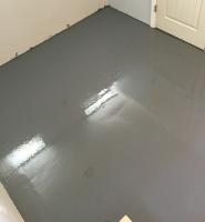 A resinous coating application on a basement floor in Denver, Colorado.