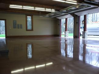 a polished garage floor with stain.
